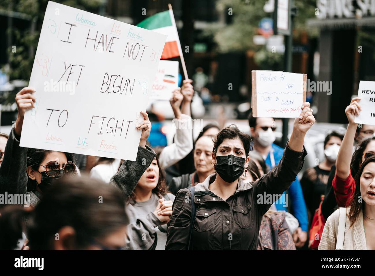Protesters hold placards expressing their opinions during an emergency
