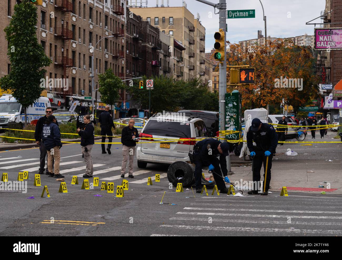New York City, USA. 16th Oct, 2022. Members of the Crime Scene Unit investigate a police shooting with officers from the 34th precinct that occured on the corner of Nagle Avenue and Dykman Street in the Washington Heights section of Manhattan, New York City, NY, on October 16, 2022. (Photo by Steve Sanchez/Sipa USA). Credit: Sipa USA/Alamy Live News Stock Photo