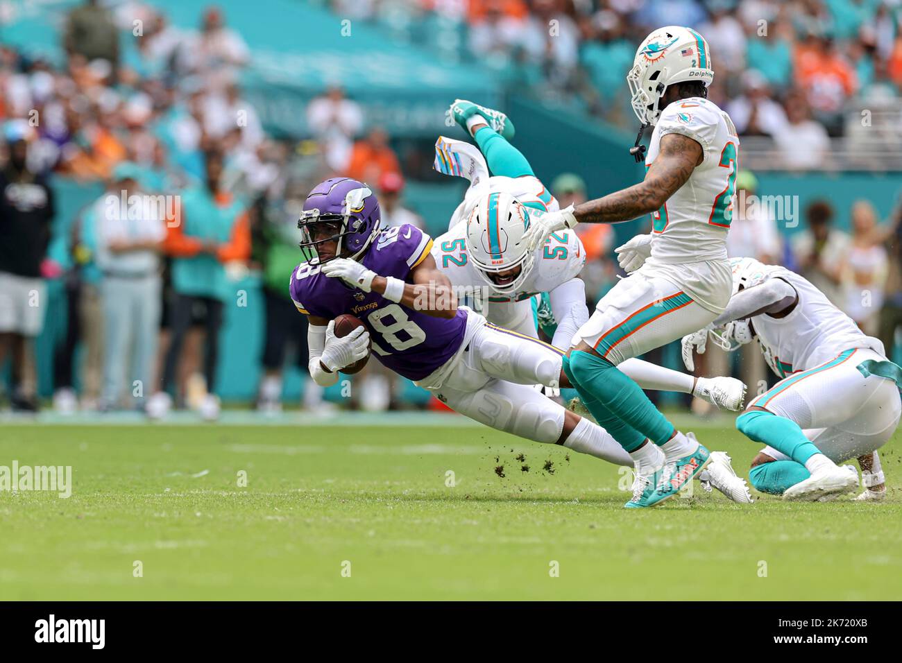 Sunday, October 16, 2022; Miami Gardens, FL USA;  Minnesota Vikings wide receiver Justin Jefferson (18) is tackled by Miami Dolphins linebacker Elando Stock Photo