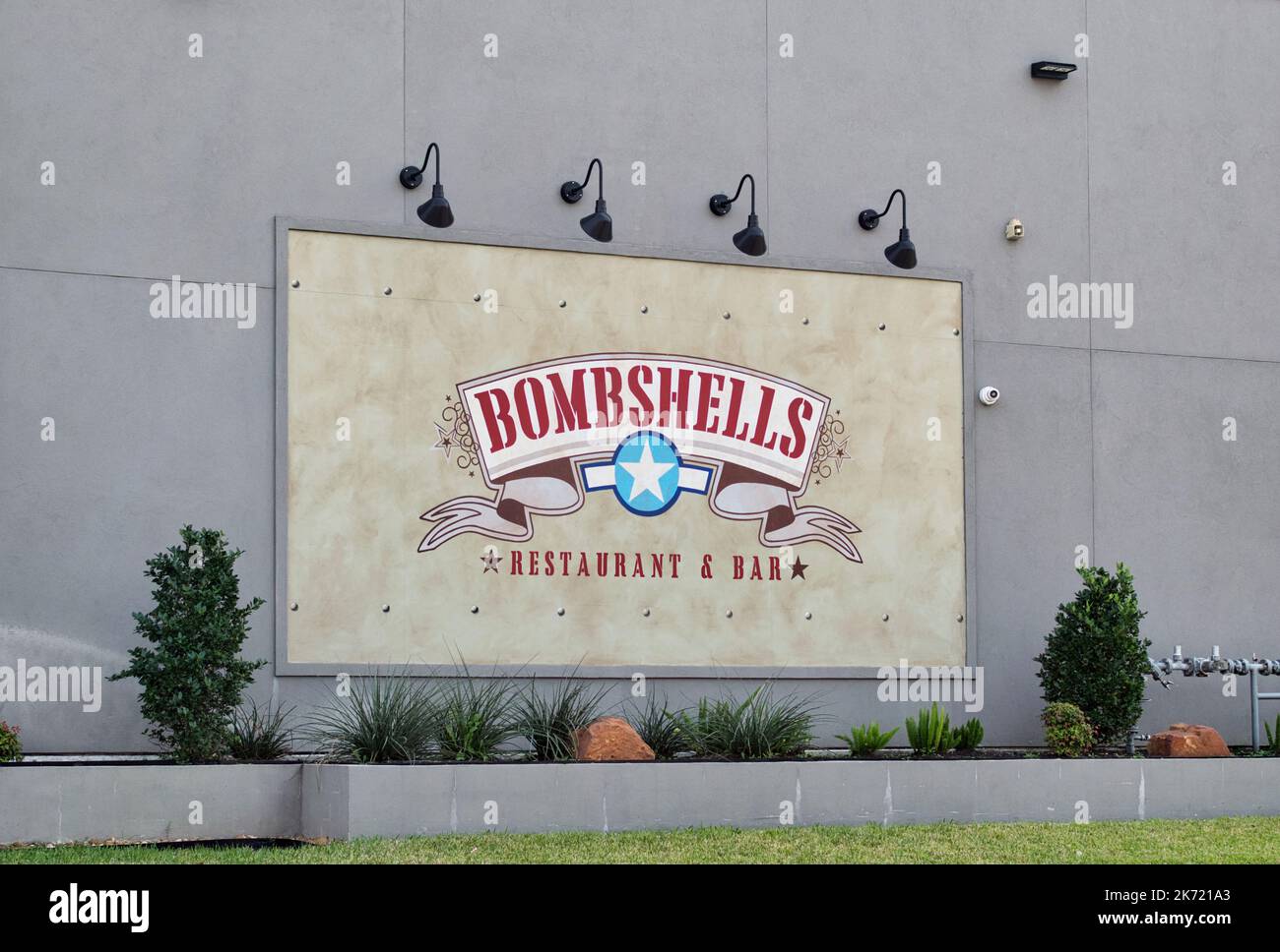 Houston, Texas USA 12-05-2021: Bombshells restaurant and bar sign on an exterior wall in Houston, TX. Military themed hospitality establishment. Stock Photo