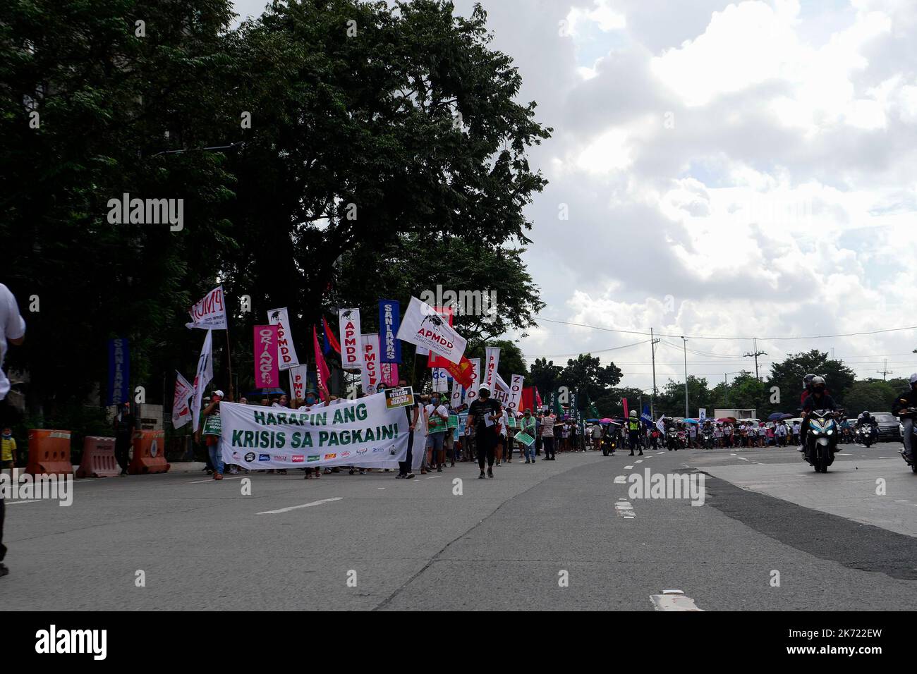 Quezon City, NCR, Philippines. 16th Oct, 2022. The climate protesters at the Department of Agriculture long Quezon City Circle to mark World Food Day. Where the protesters carrying empty pots and pans and the peopleÃ¢â‚¬â„¢s demands for the Marcos government to address the food crisis. More than 800 will protest in front of the Department of Agriculture (DA) against the surge in food prices in the country and call on President Marcos, who is also the Agriculture Secretary, to prioritize peoplesÃ¢â‚¬â„¢ right to food amidst the climate and food crises. The rising prices of basic commoditi Stock Photo