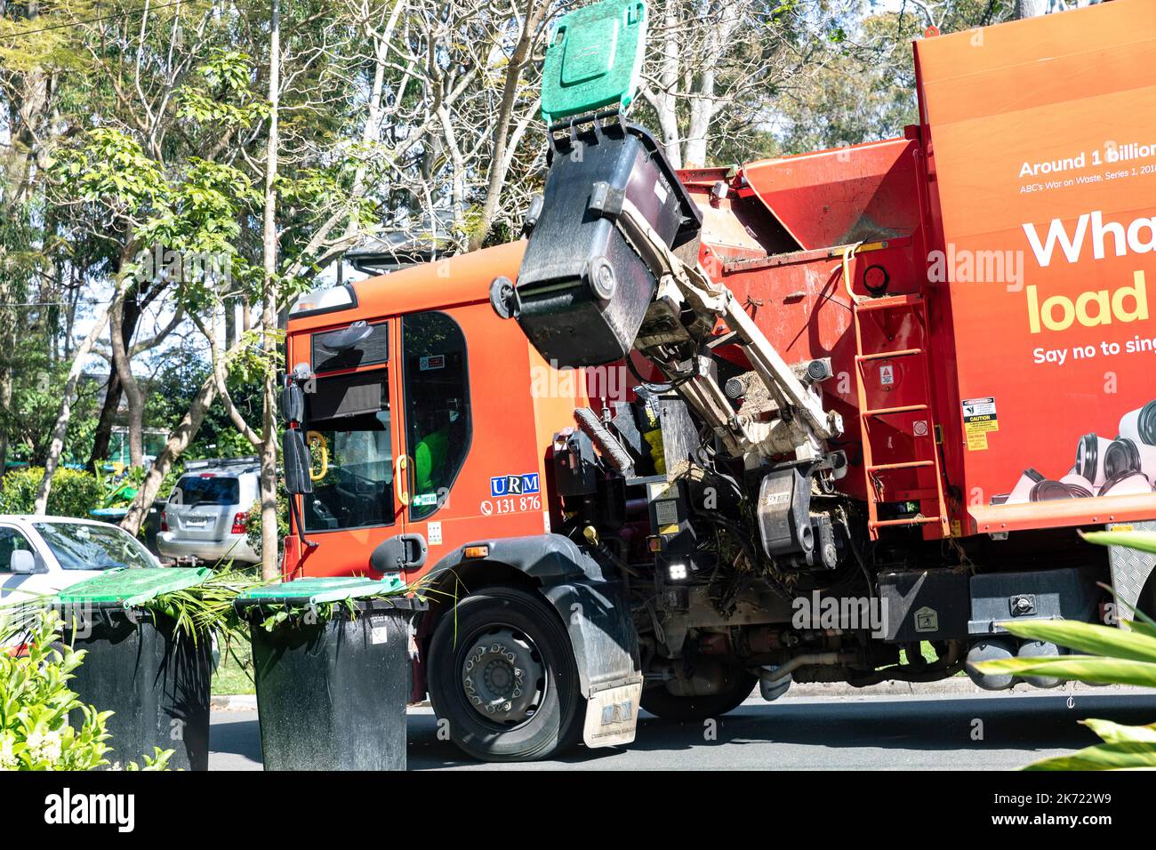 Australia, council vehicle picks up and empties green waste vegetation