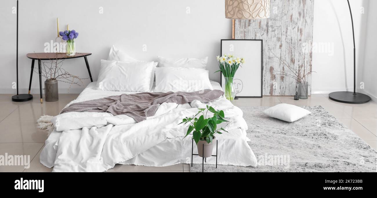 Interior of light bedroom in Scandinavian style Stock Photo - Alamy