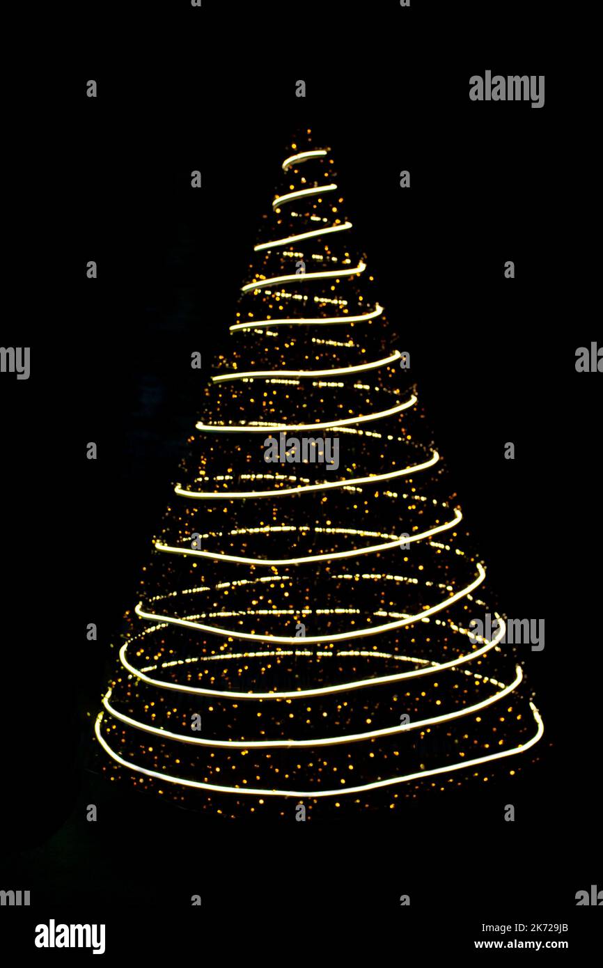 Defocused lights Christmas tree on black isolated background. Design element. New Year. Copy space Stock Photo