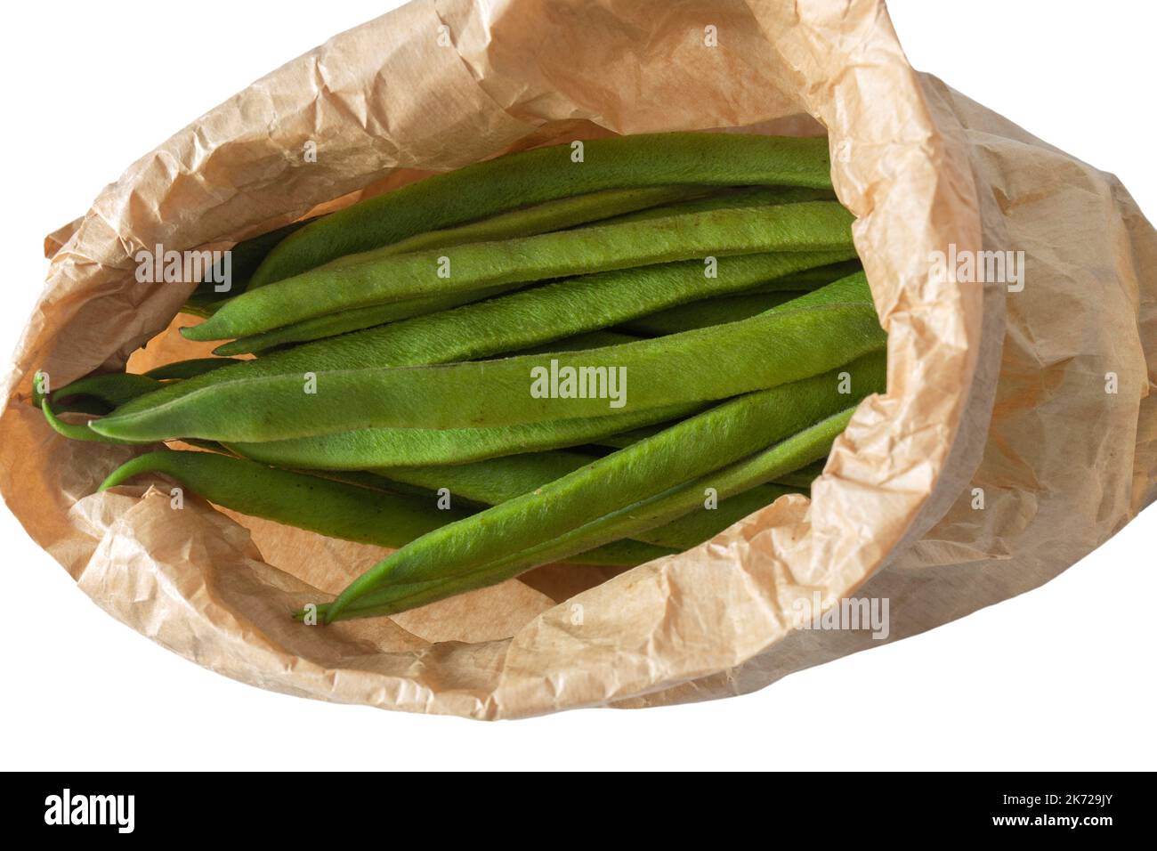 Raw green beans in a brown paper bag.  Eco friendly recycling packaging concept Stock Photo