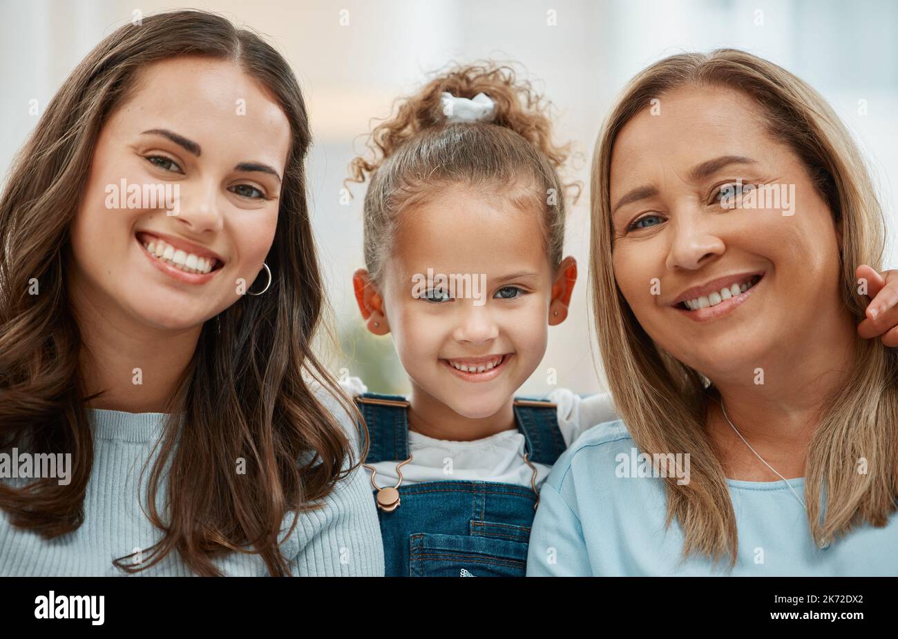 Seeing life through their eyes. a young woman and her mother spending time with her daughter. Stock Photo