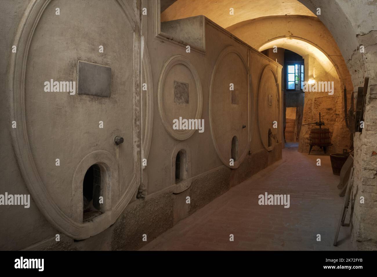 Ancient underground wine cellar with concrete container for wine