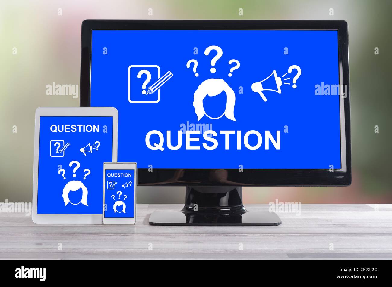 Question concept shown on different information technology devices Stock Photo