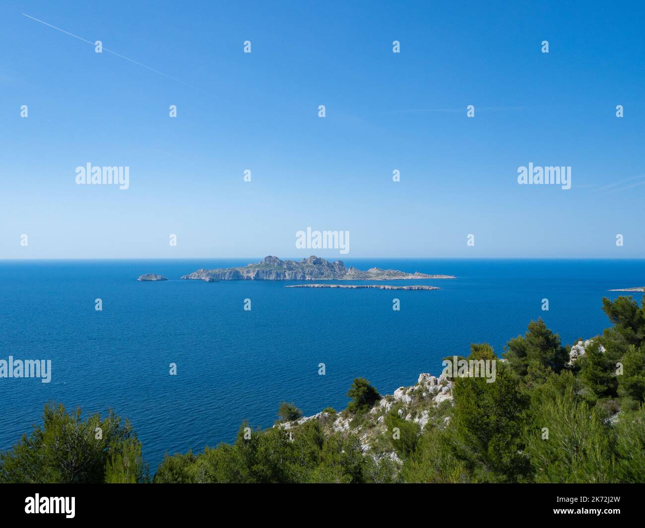 Calanques, France - May 20th 2020: Hiking high above the Mediterranean Sea along a rocky coast Stock Photo
