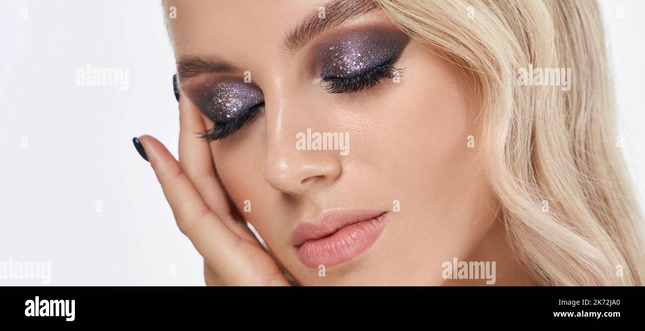 Closeup shot of woman eye with evening makeup. Long eyelashes. Smokey Eyes. Studio shot Stock Photo