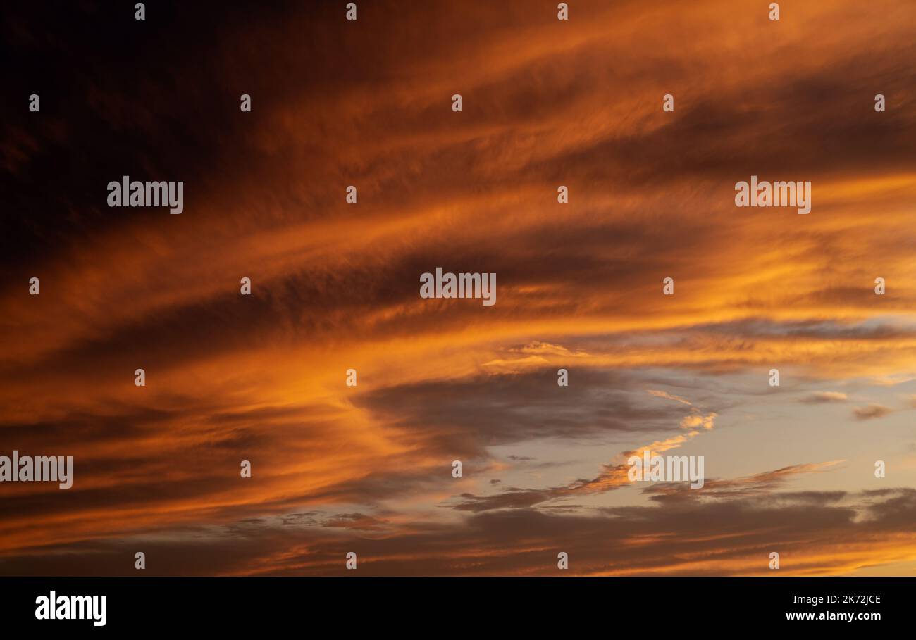 Sunset sky with orange clouds. Nature background Stock Photo - Alamy