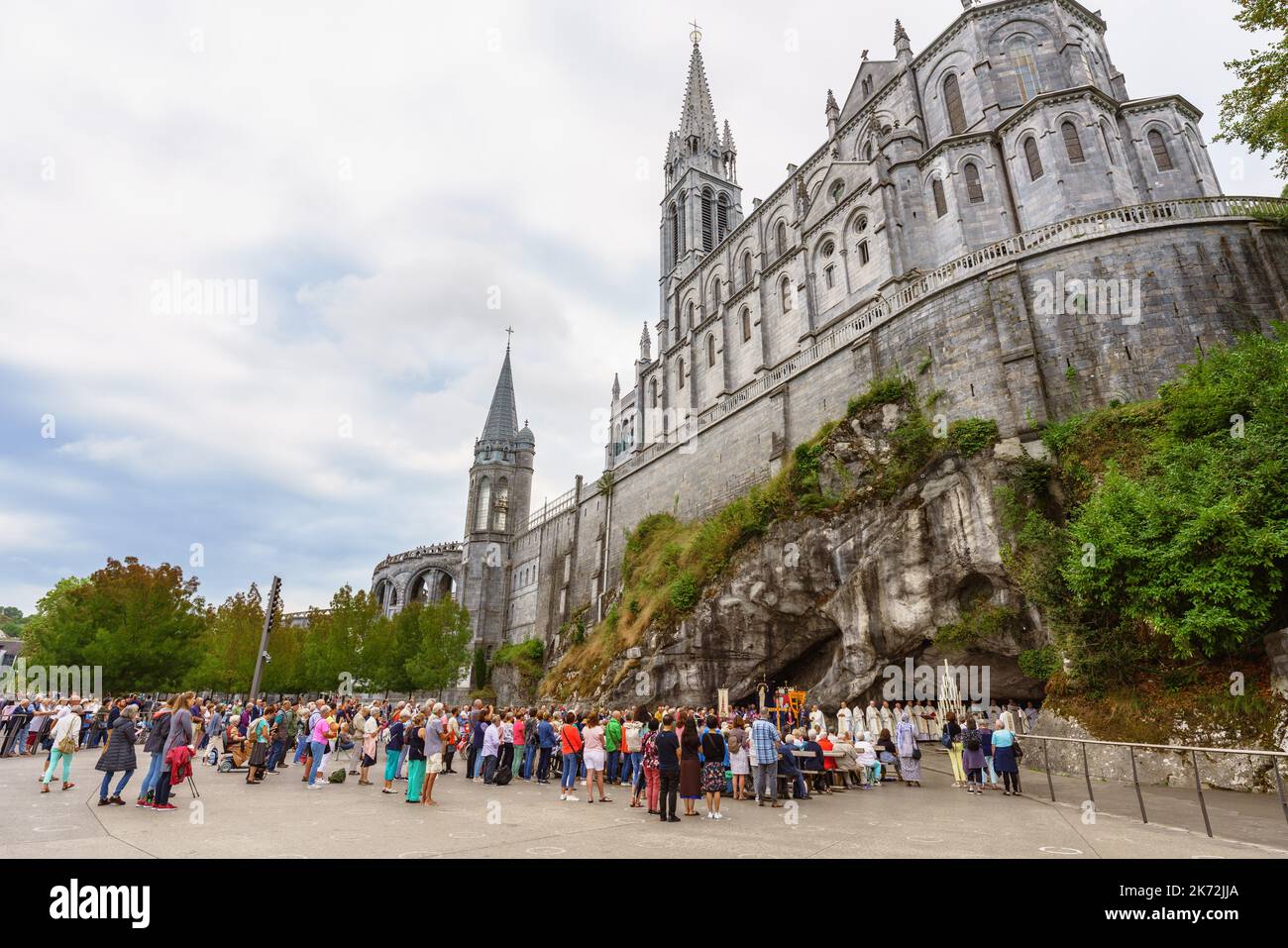 Lourdes, France. September 2, 2022. Hundreds of pilgrims assist to worship at the Massabielle Grotto in the Sanctuary of Our Lady of Lourdes Stock Photo