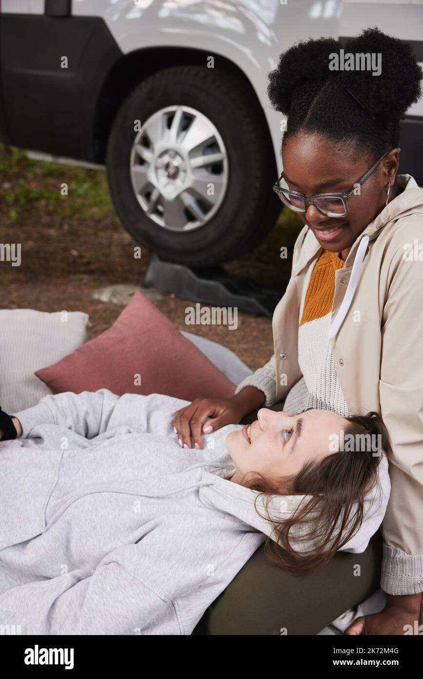 Friends relaxing at camping Stock Photo