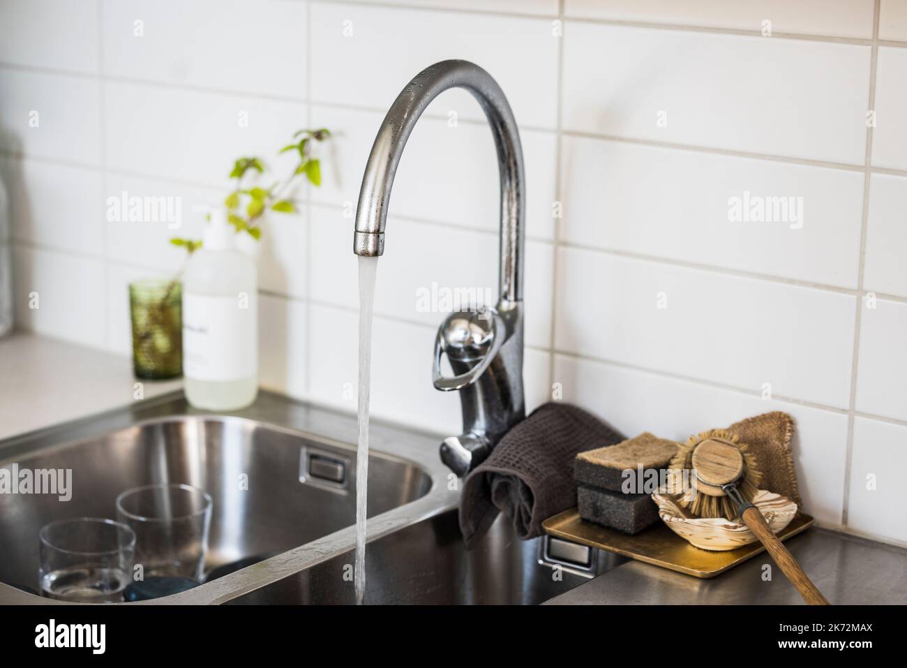 Water running in kitchen sink Stock Photo Alamy