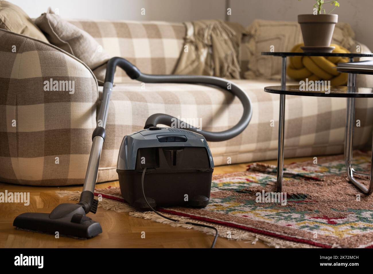 Oldfashioned vacuum cleaner in living room Stock Photo Alamy