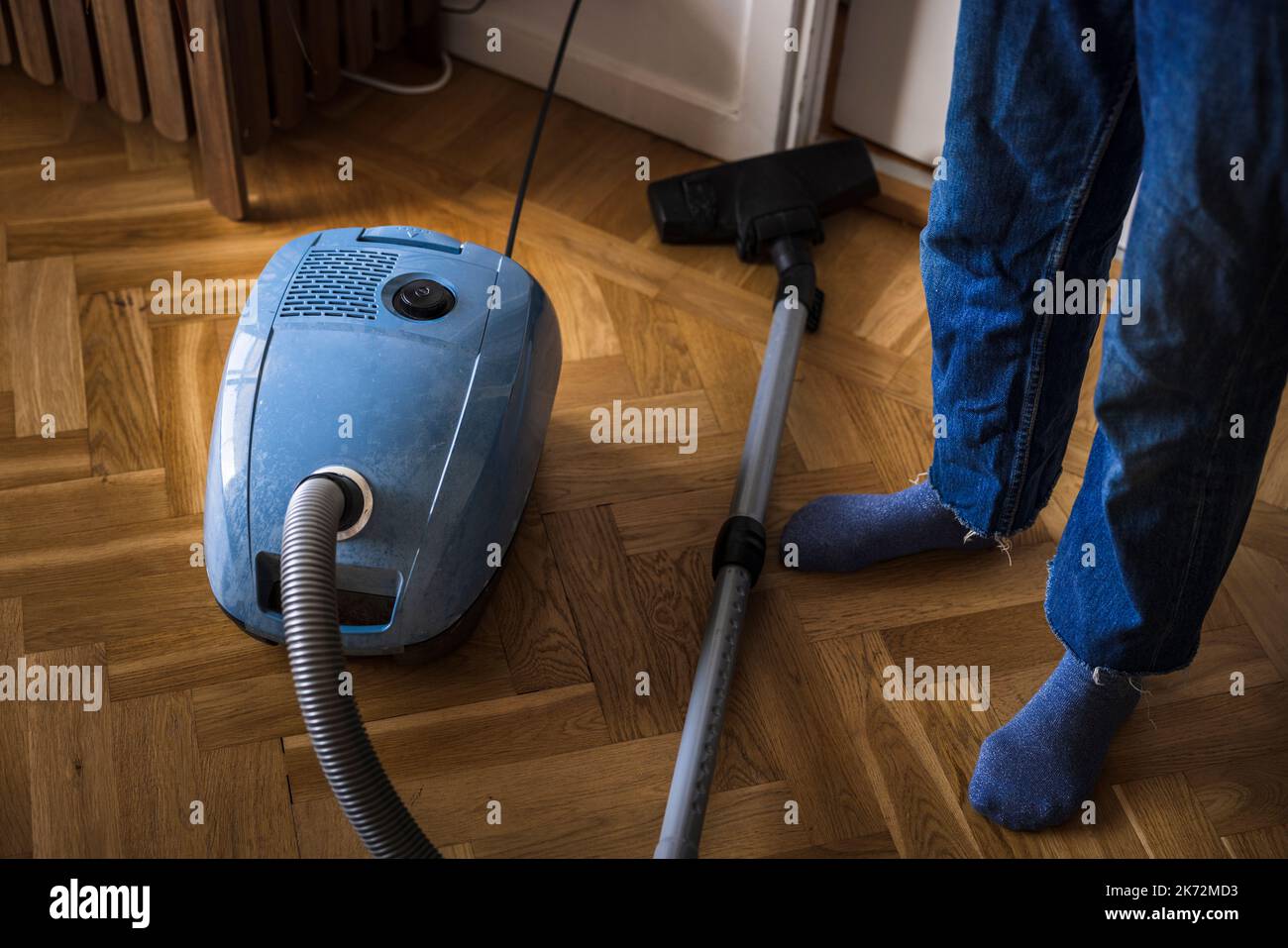 Woman using oldfashioned vacuum cleaner Stock Photo Alamy