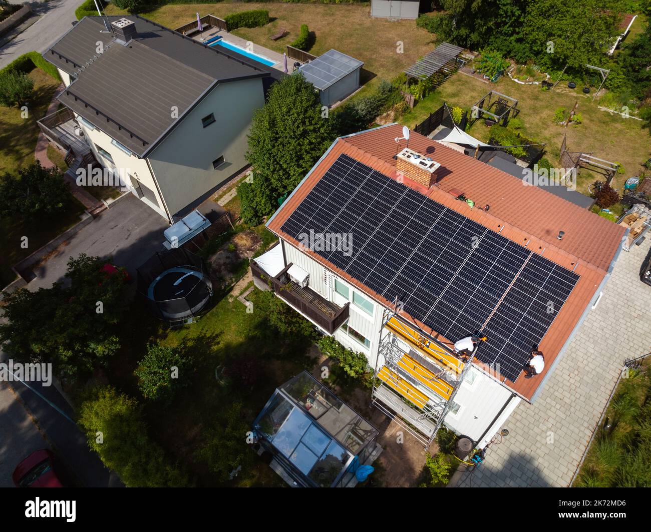 Installation of solar panels on roof of house Stock Photo - Alamy - Solar Panel Installation On Penthouse Roof