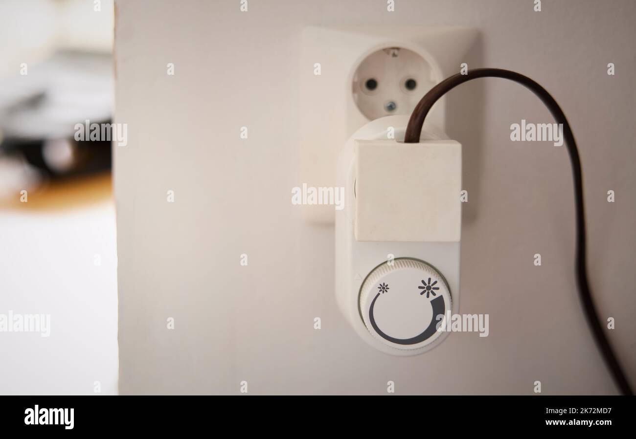 Thermostat plug in wall outlet Stock Photo Alamy