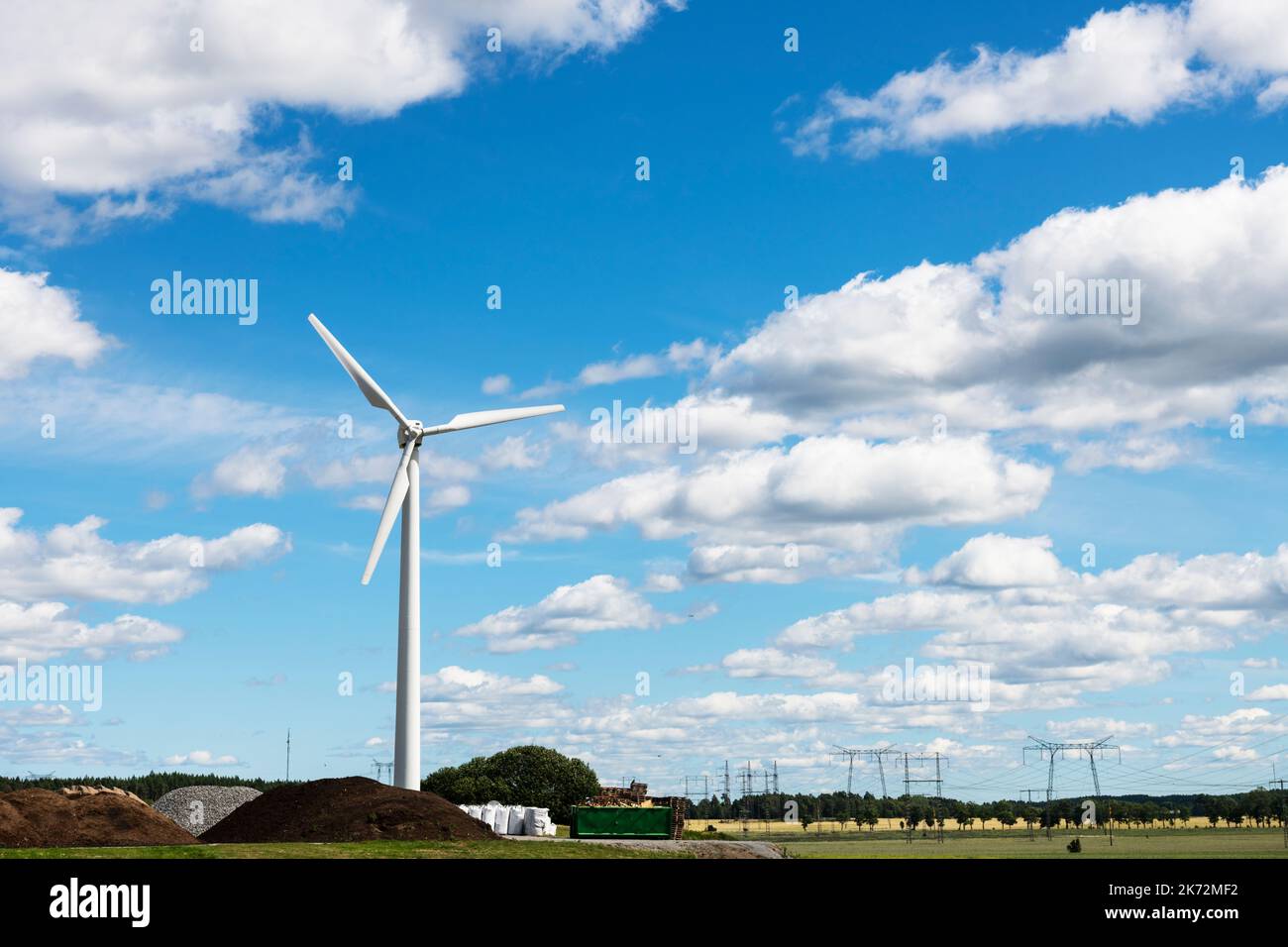 Wind turbine against blue sky Stock Photo - Alamy