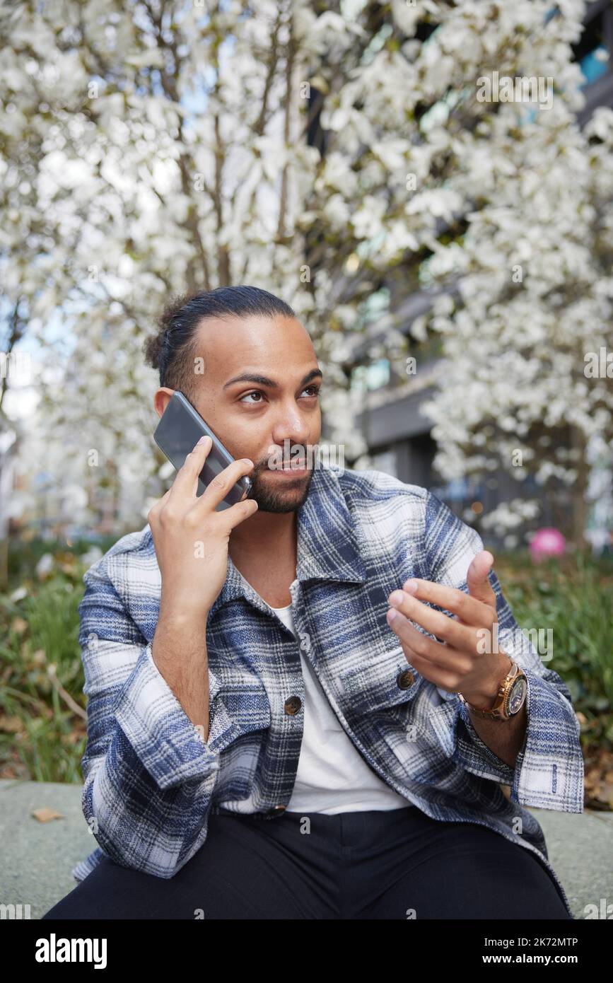 Smiling man using cell phone Stock Photo - Alamy