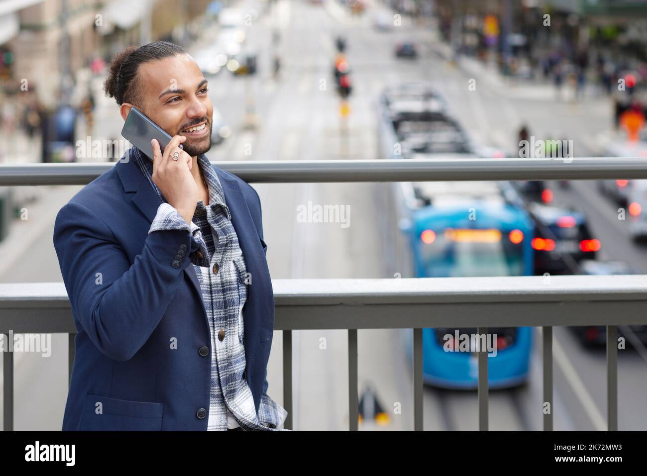 Smiling man talking via cell phone Stock Photo