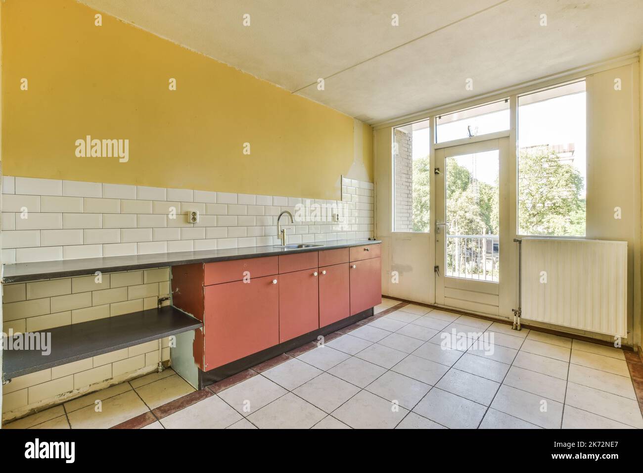 Interior of empty kitchen with windows Stock Photo Alamy