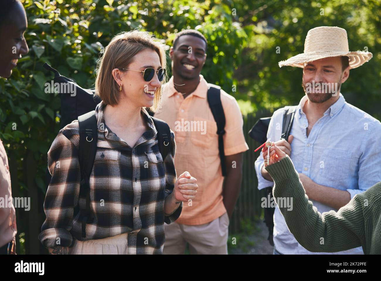 Friends talking together Stock Photo - Alamy