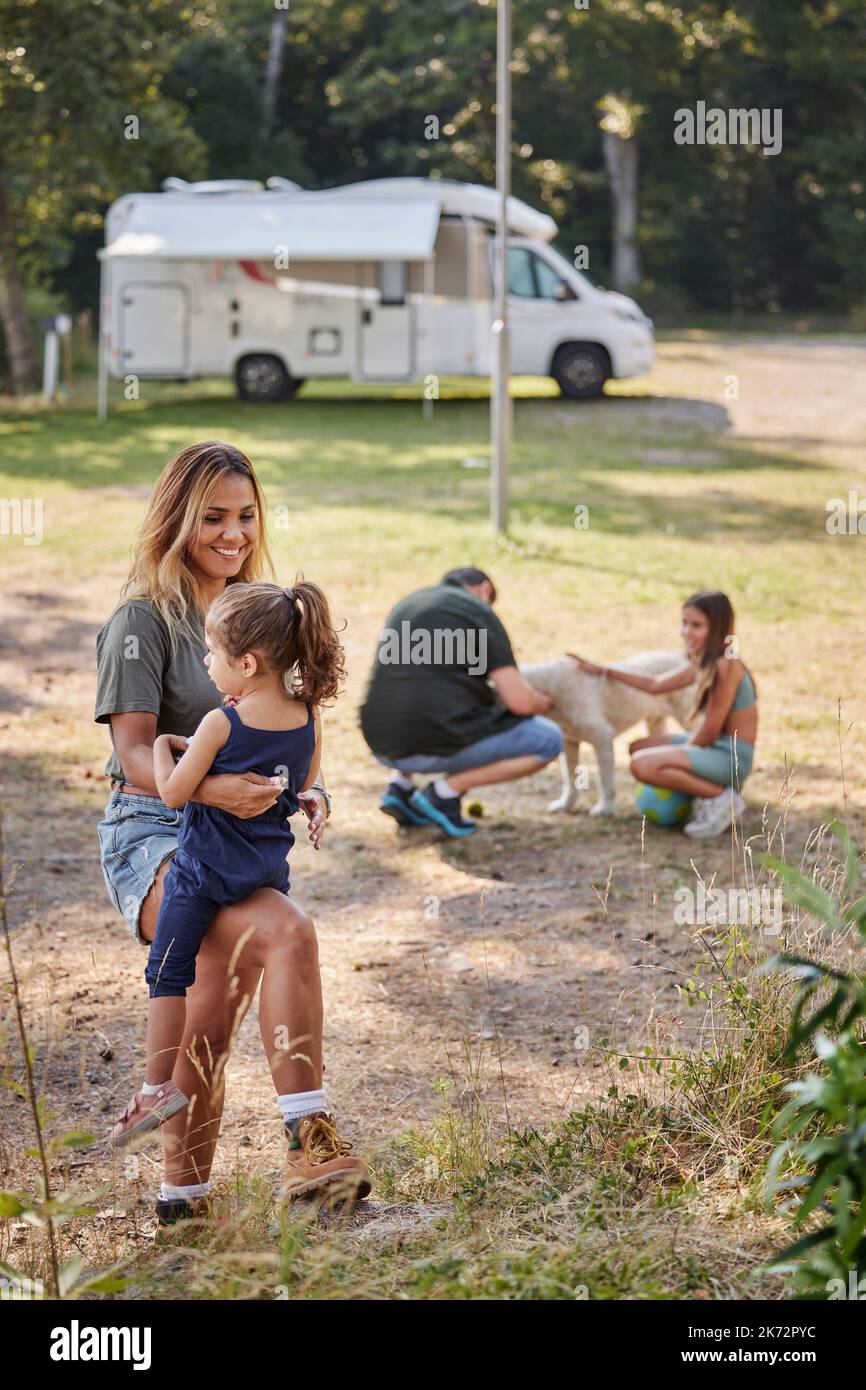 Mother with daughter at camping site Stock Photo