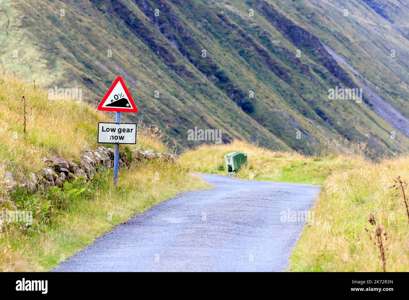 Low Gear Now warning sign on a single track rural road Stock Photo