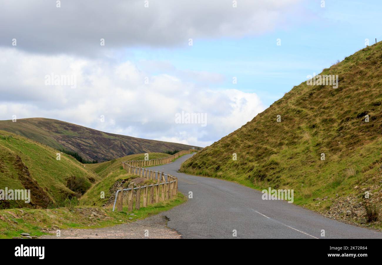 Winding road with safety a fence fitted to one side on the road to ST Mary's Loch in the Scottish Boaders Stock Photo