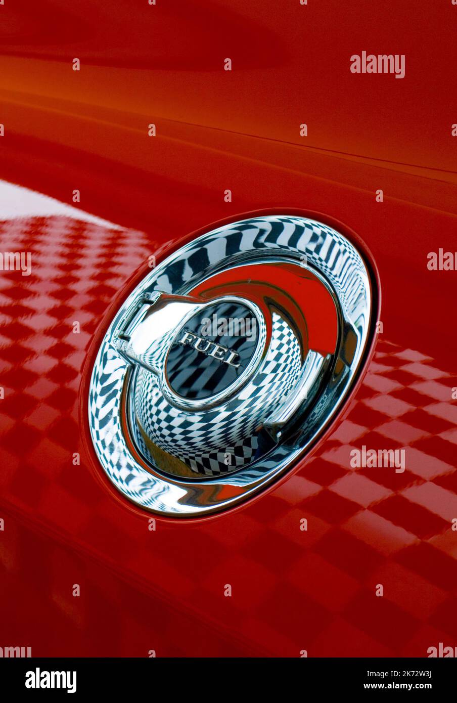 Fuel filler cap reflecting a chequered flag Stock Photo