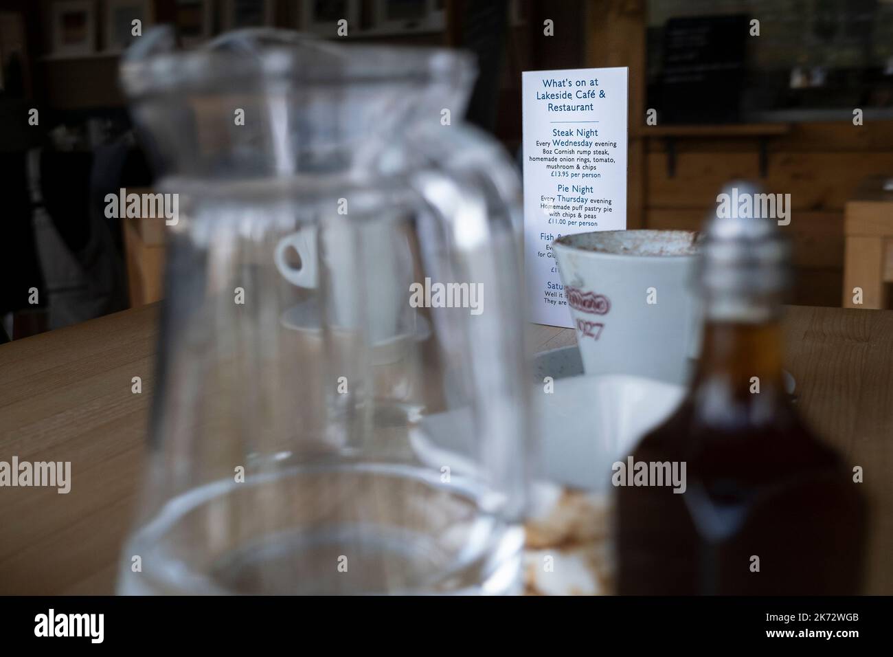A whats on notice on a table in a restaurant in Newquay in Cornwall in the UK. Stock Photo