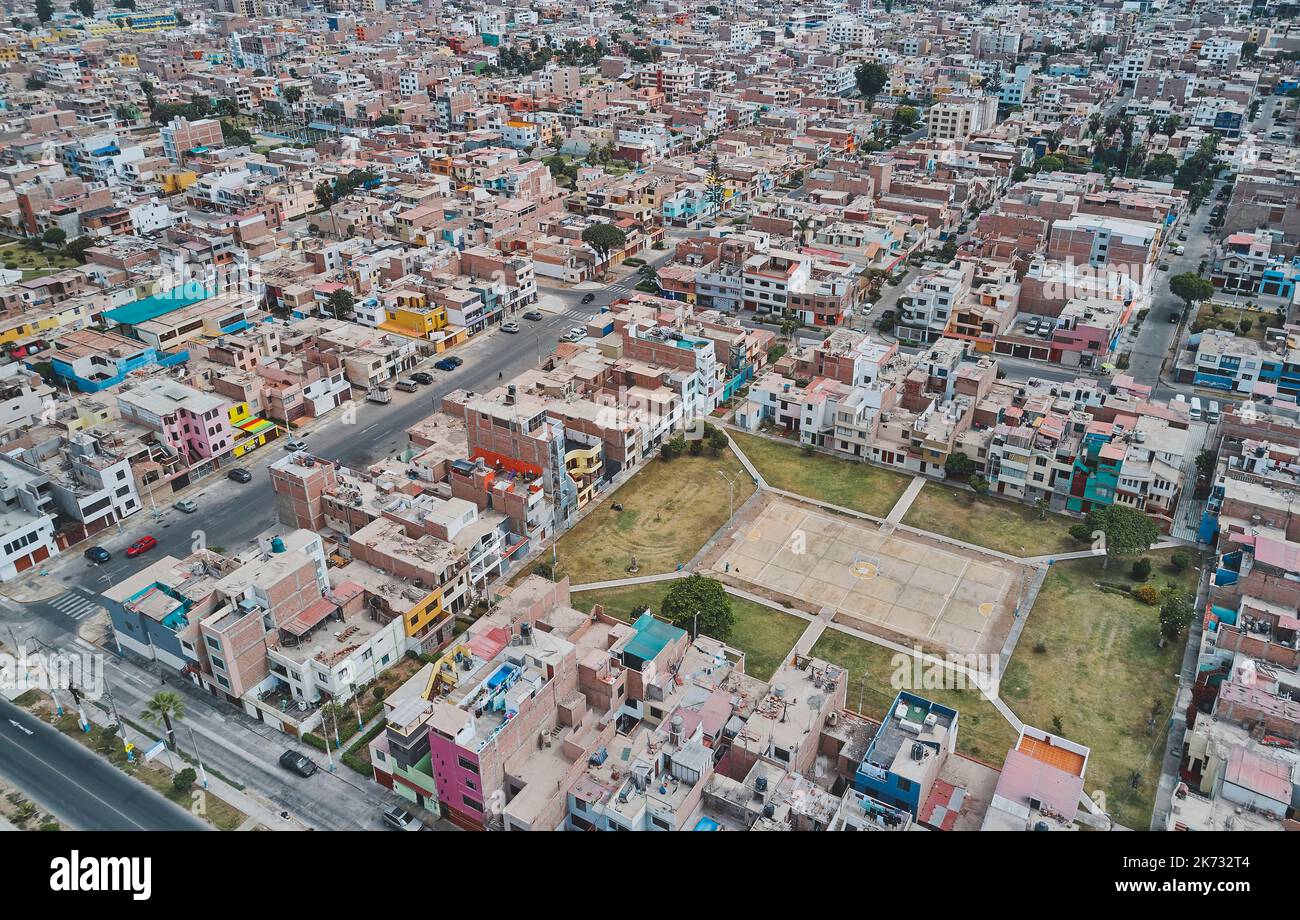 Aerial view of the football field in the middle of a messy neighborhood