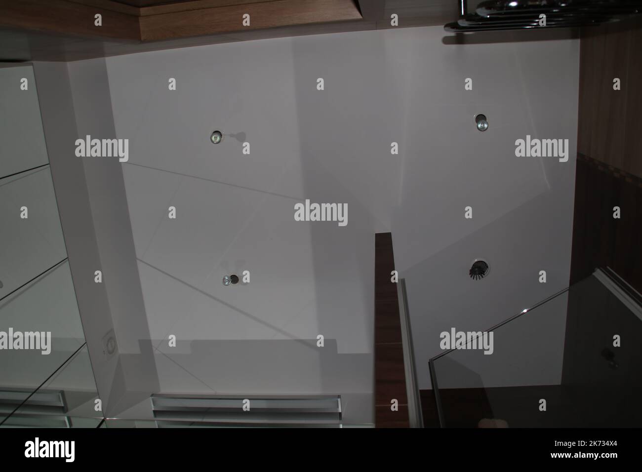 replacing light bulbs in the bathroom Stock Photo Alamy