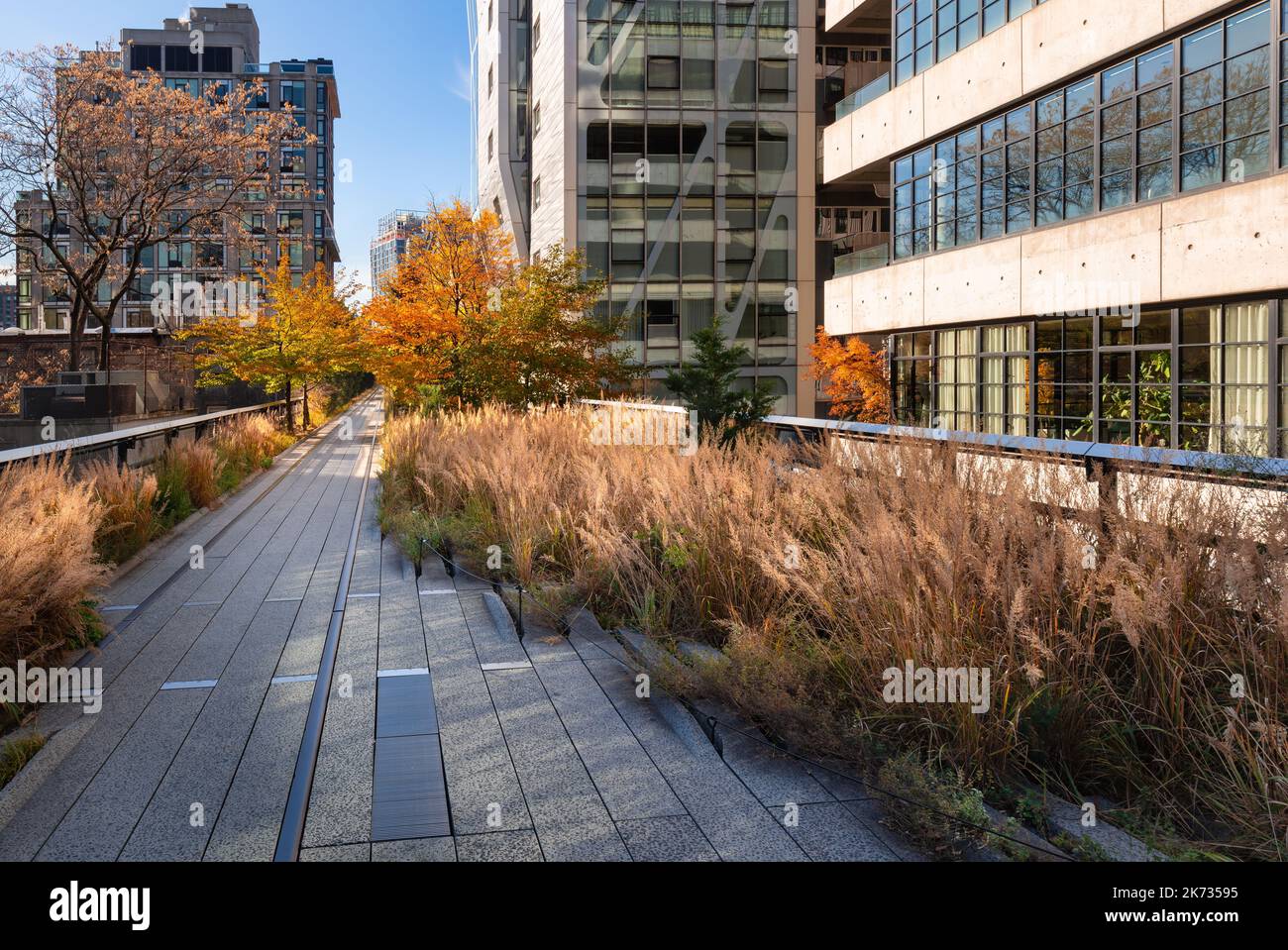 New York City High Line promenade in fall. Elevated greenway and rail trail created on a former New York Central Railroad. Chelsea, Manhattan Stock Photo