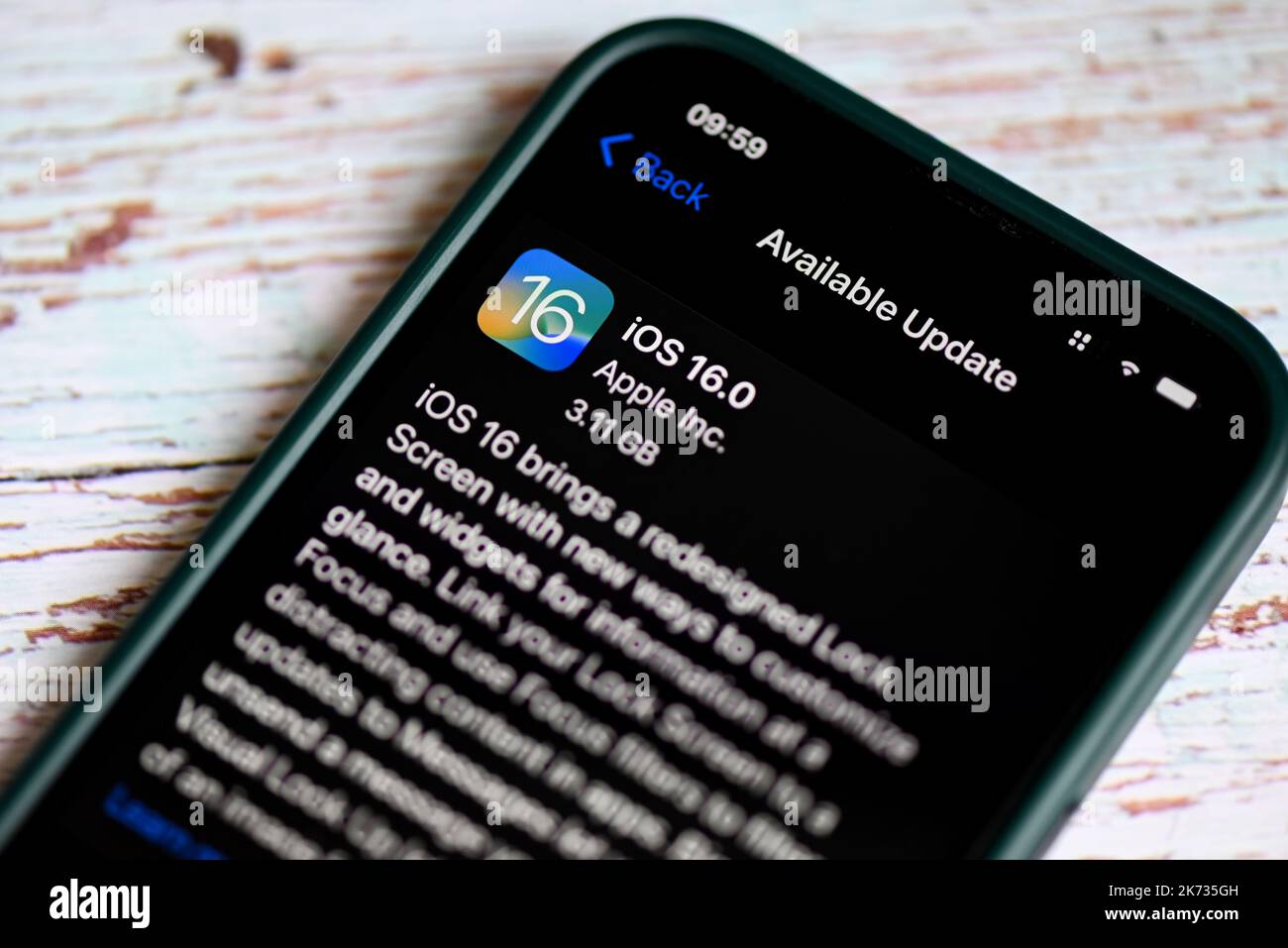 iPhone with iOS 16 logo on the screen close up, new operating system ...