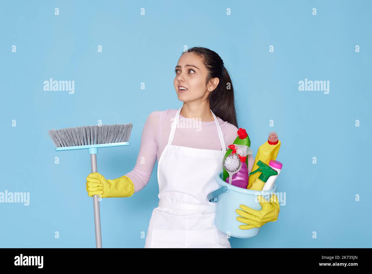 pretty woman in rubber gloves and cleaner apron Stock Photo - Alamy