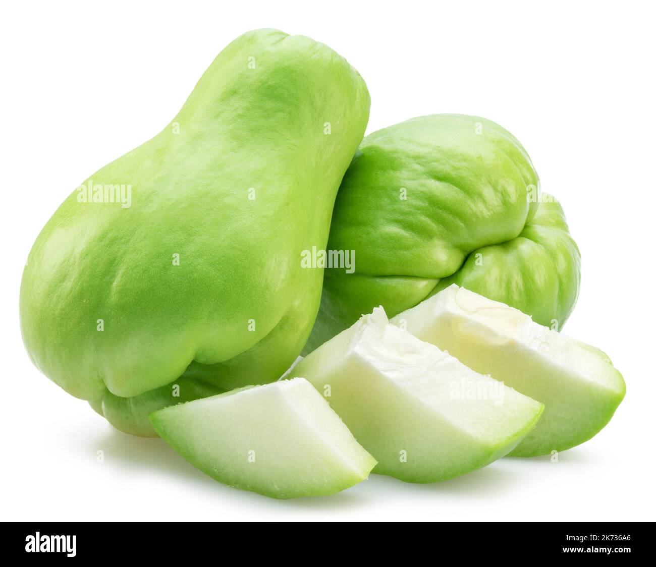 Chayote fruits and chayote slices isolated on white background. Stock Photo