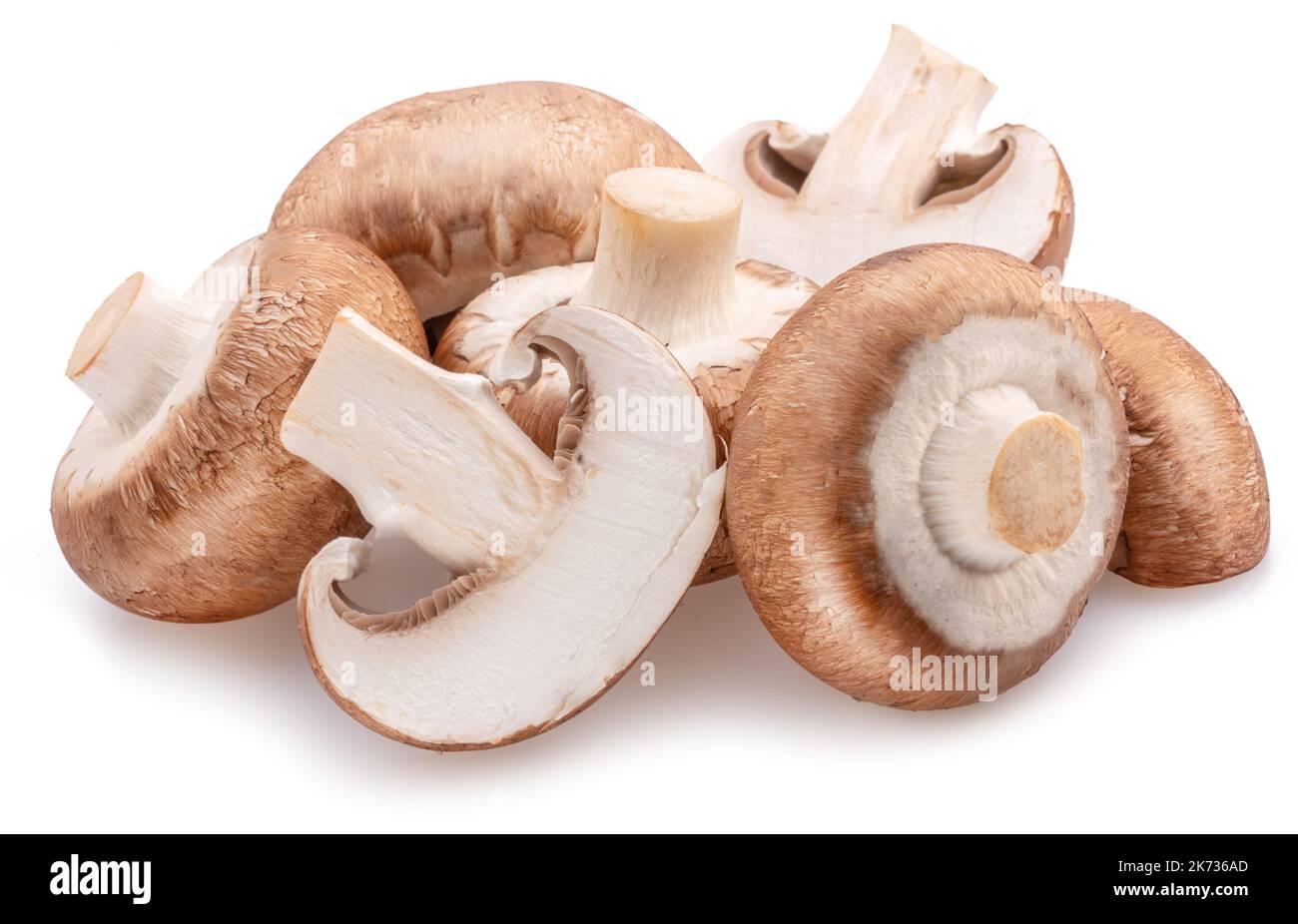 Brown cap champignons with slices of champignon mushroom isolated on white background. Close-up. Stock Photo
