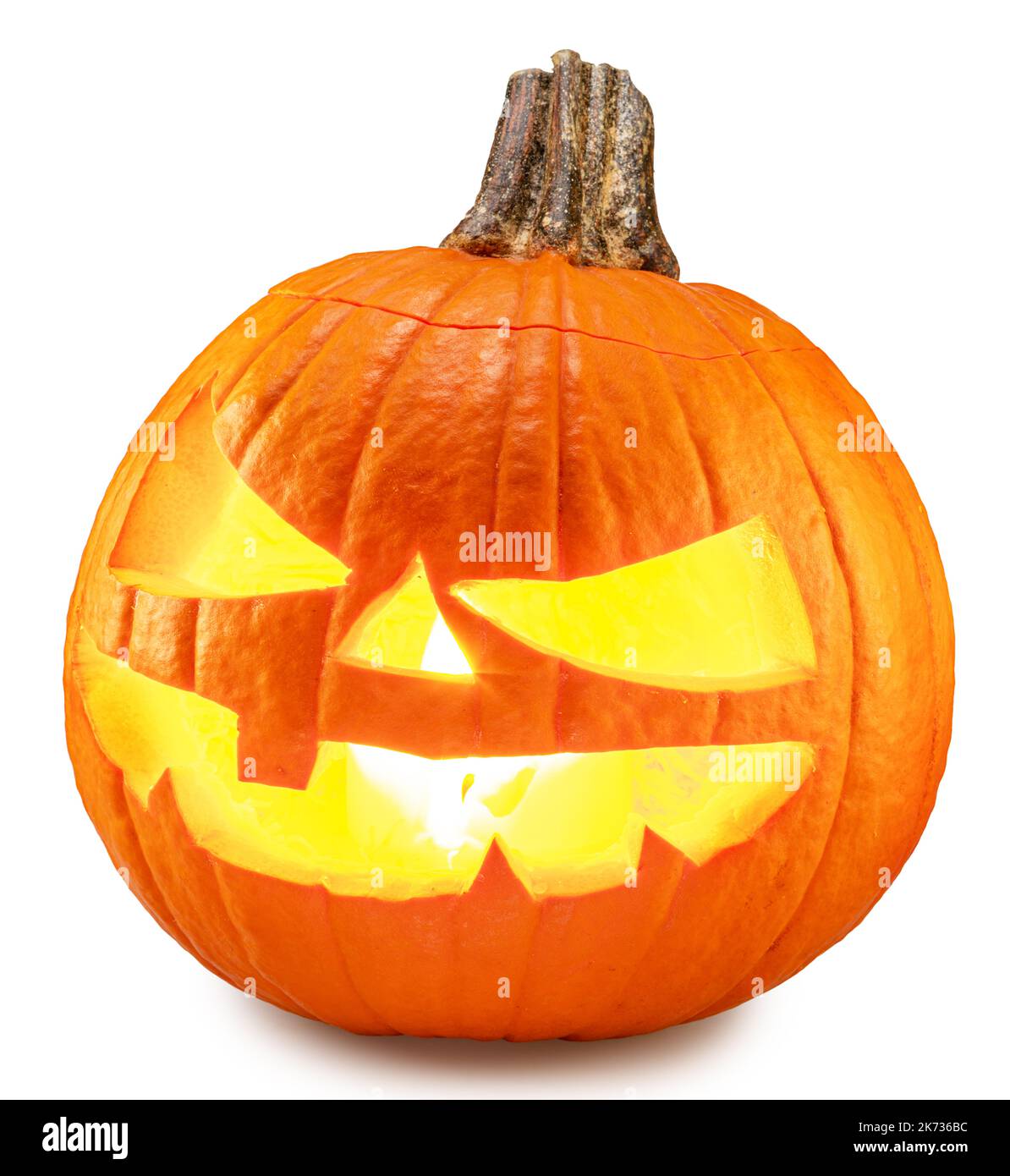 Carved pumpkin for Halloween jack-o'-lanterns with scary smiles and burning candle inside on white background. Clipping path. Stock Photo