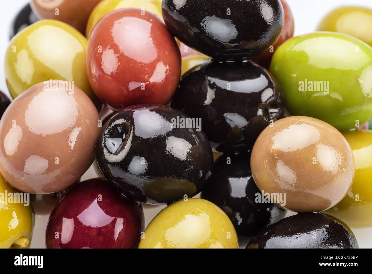Kalamata, green and black olives. Food background. Stock Photo