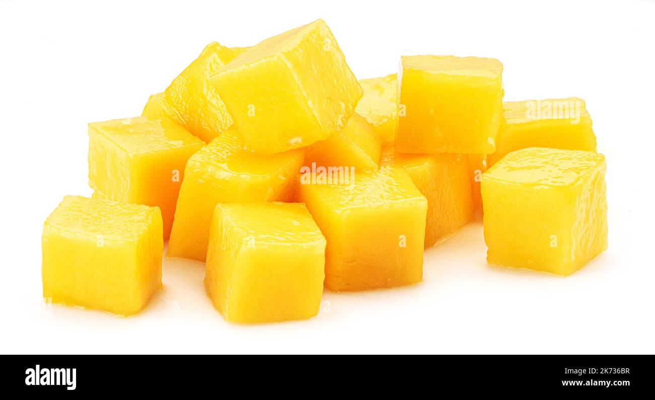 Juicy mango cubes isolated on white background. Stock Photo