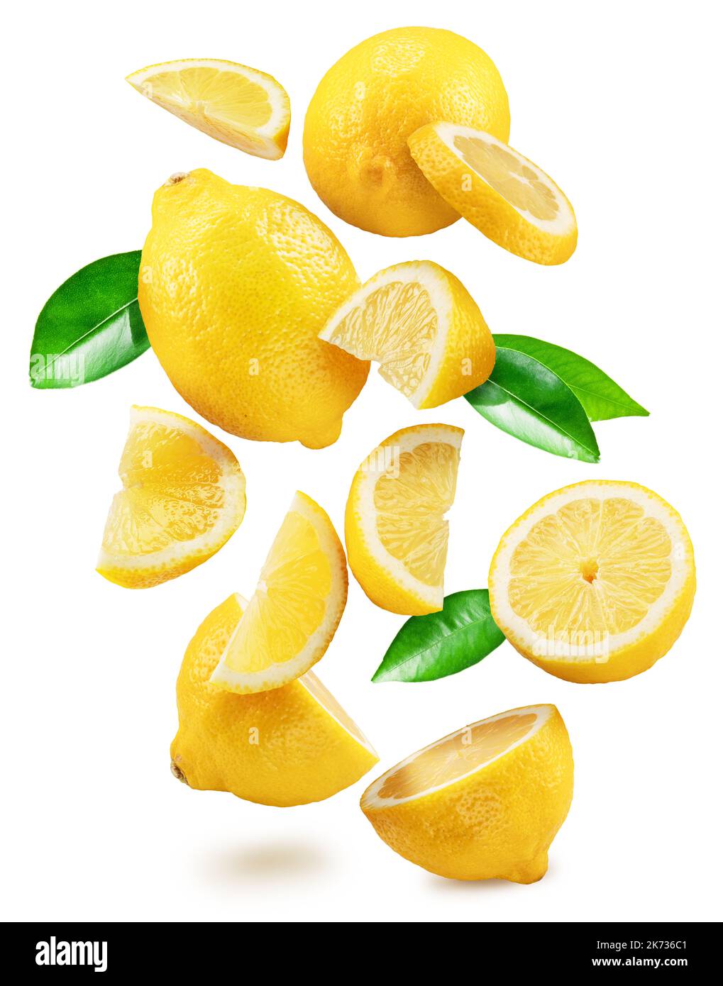 Ripe lemon fruits, slices and leaves flying in air white background. File contains clipping paths. Stock Photo
