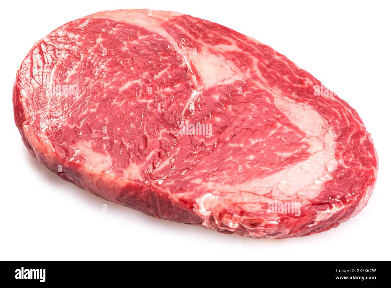 Raw ribeye steak isolated on white background. Top view. Stock Photo