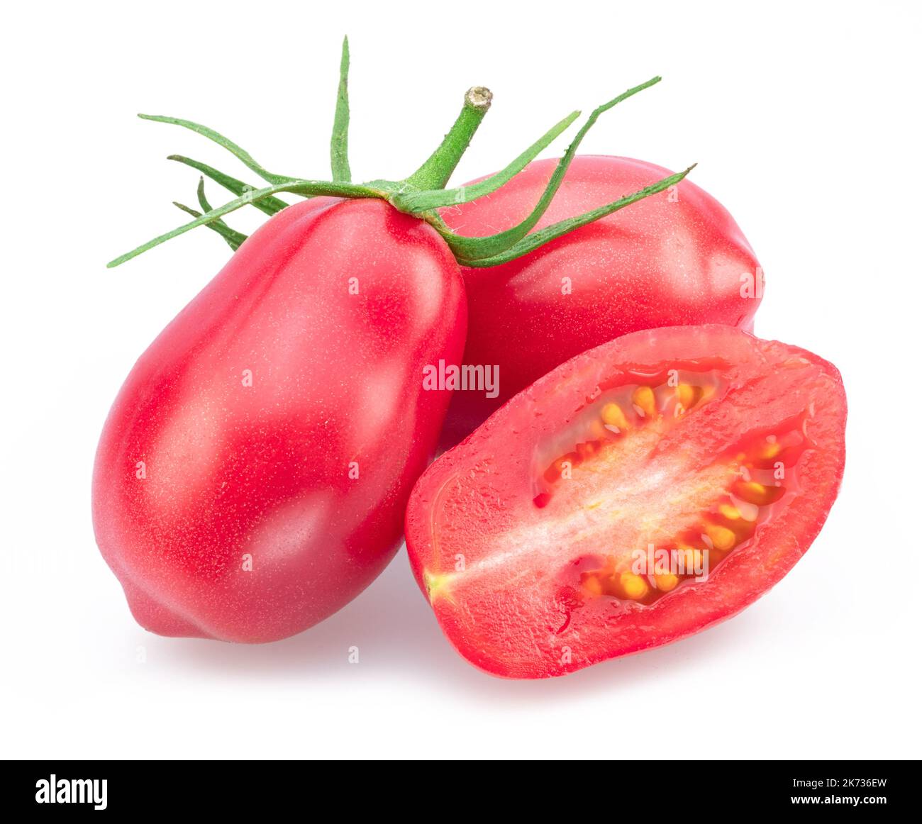 Pink tomatoes (plums) with tomato slice isolated on white background. Stock Photo