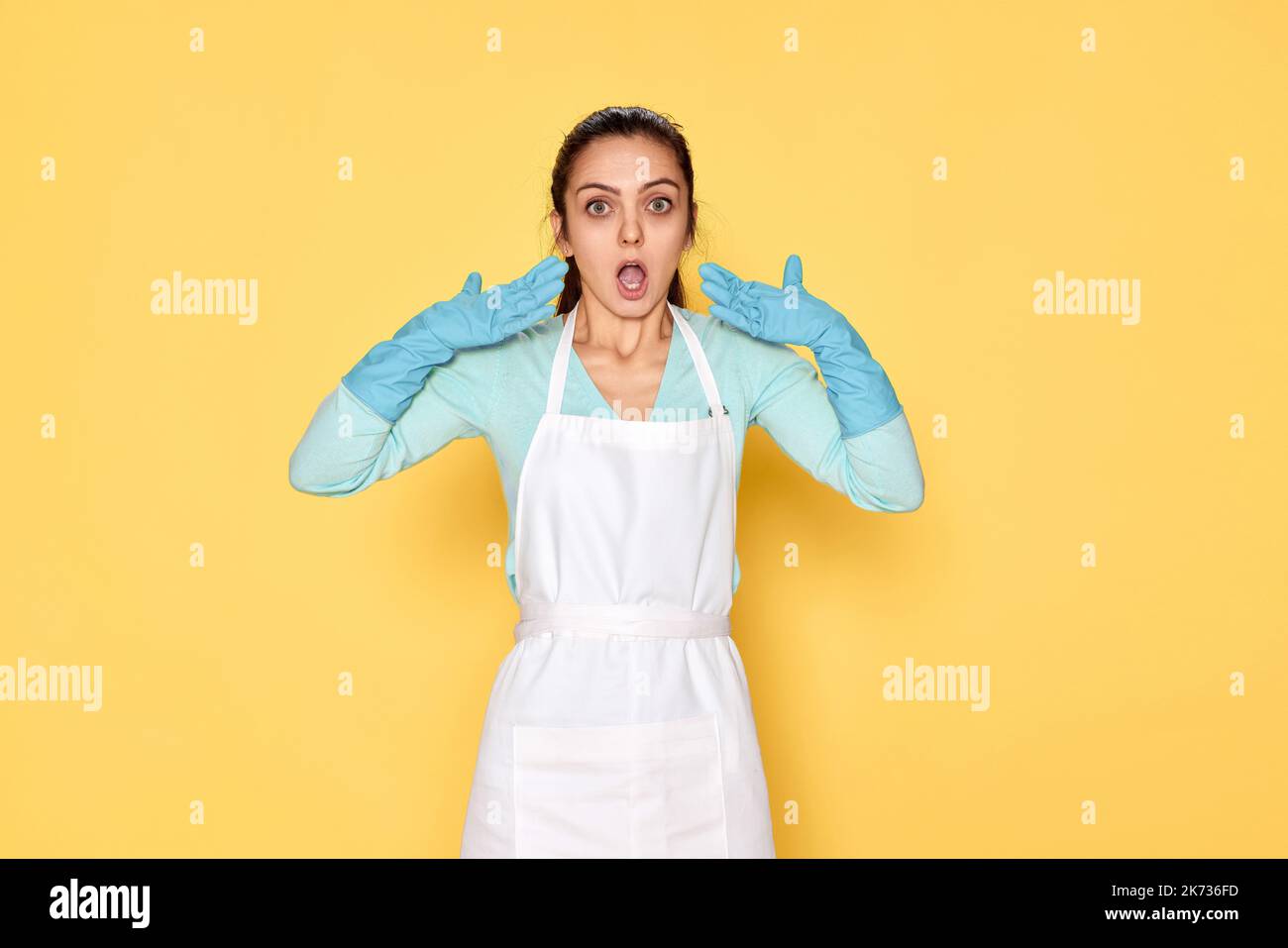 woman in rubber gloves and cleaner apron Stock Photo - Alamy