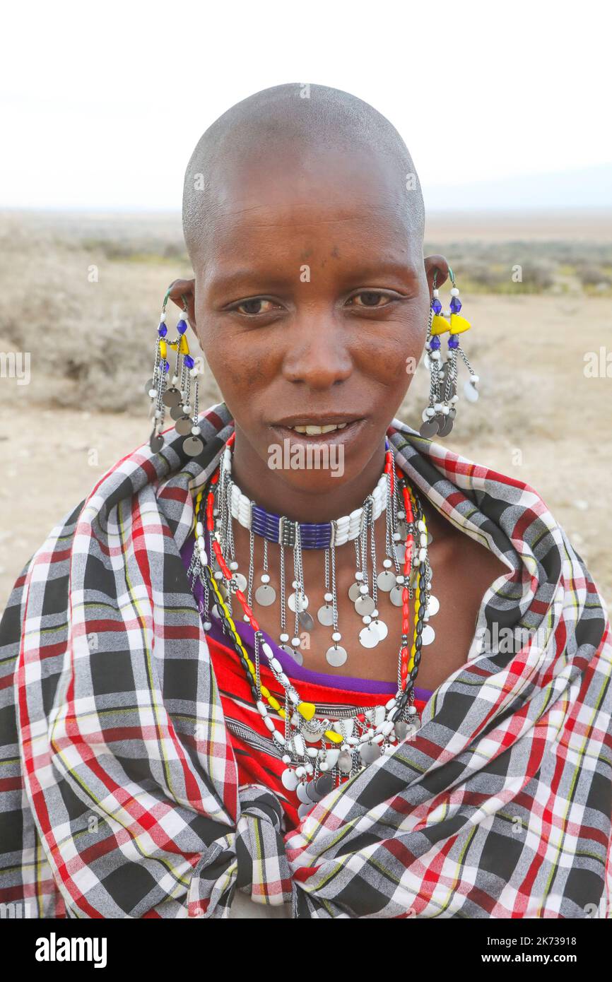 Young Maasai man after circumcision wearing black Shuka white face