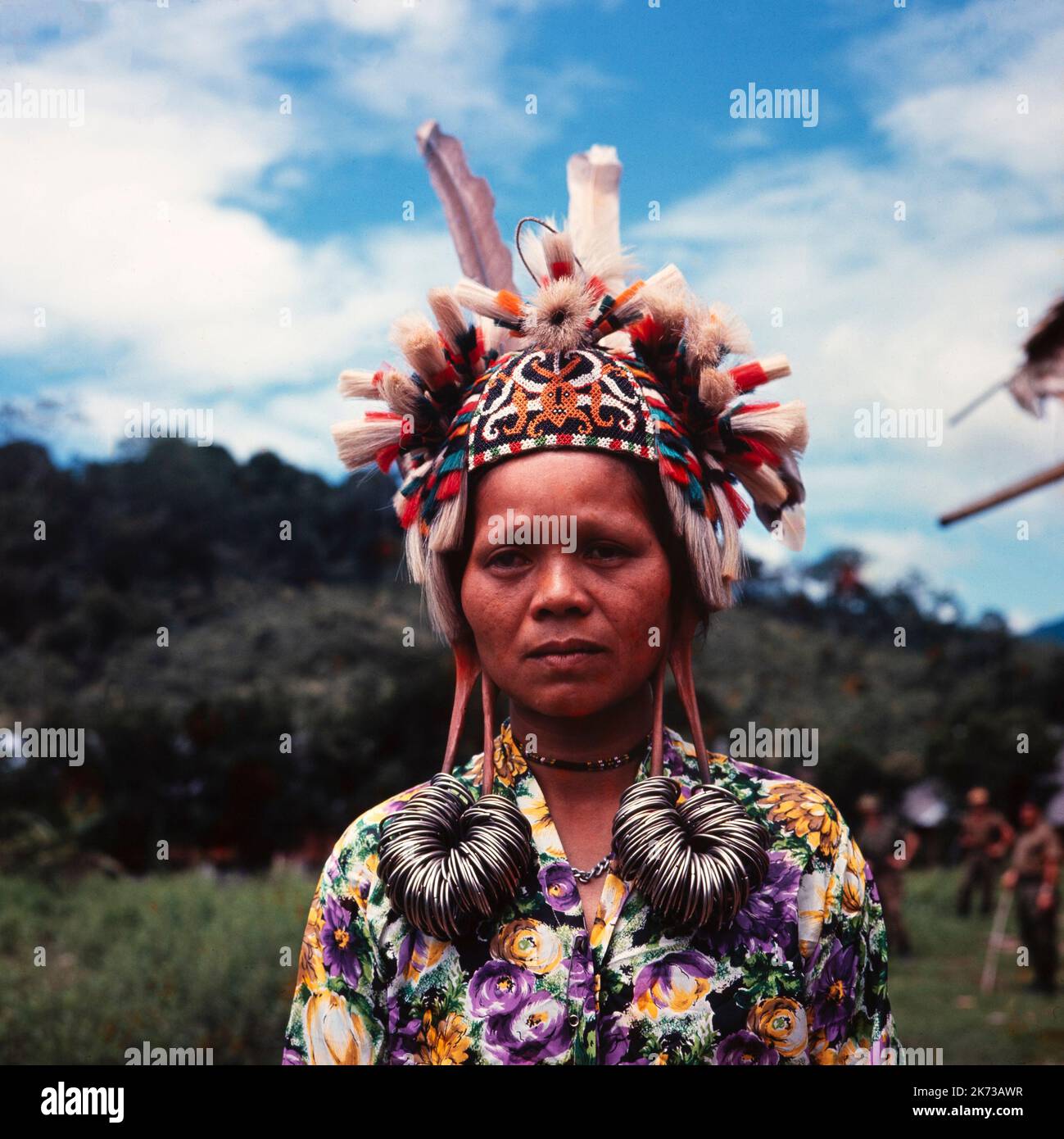 A vintage colour photograph taken in February 1965 showing a women of the Dayak tribe of North Borneo Stock Photo