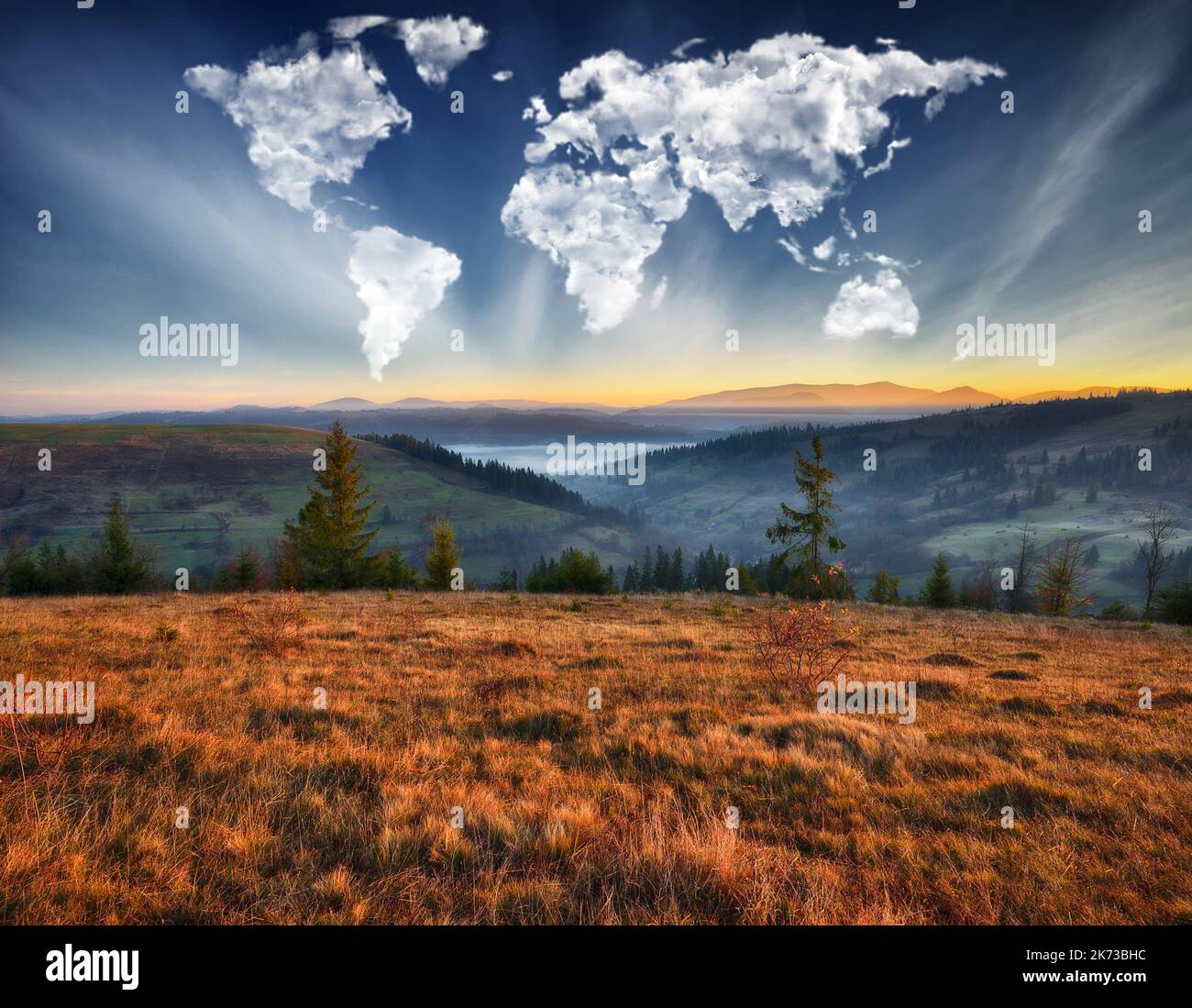 clouds in the form of a map of the world over the mountains. autumn ...