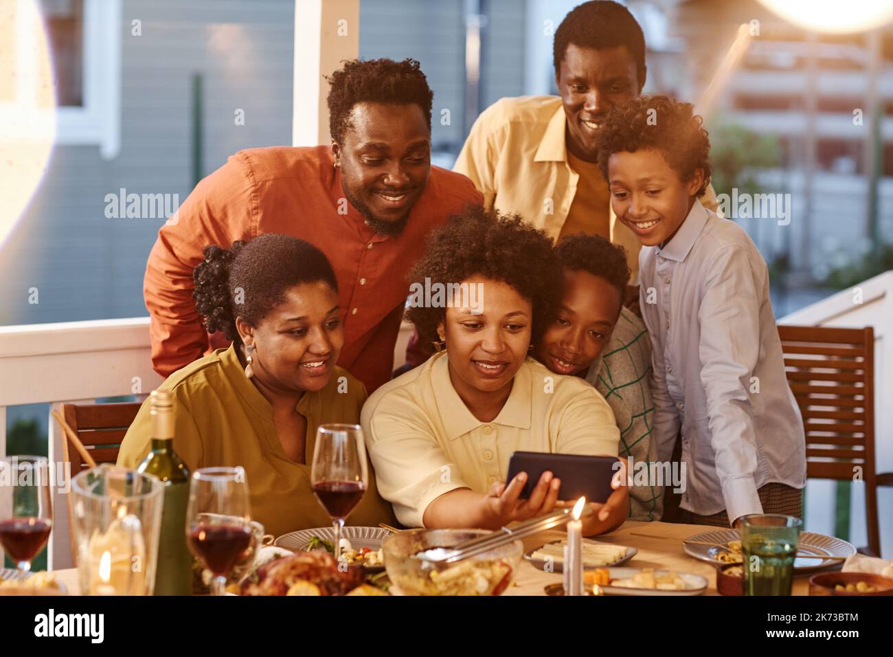 Portrait of African American family taking selfie photo at dinner in ...